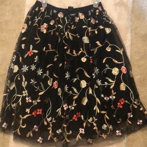 Black skirts with stitch flowers